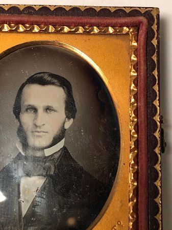Daguerreotype of man with large square bowtie  stamped Pollack Balto 6.jpg