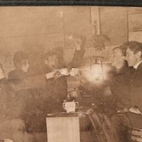 5 Young Men Drinking with Tea Cups By Glowing Lantern Light 4.jpg