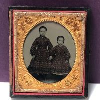 Circa 1870s Ambrotype of Two Sisters Dressed Exactly The Same 1.jpg